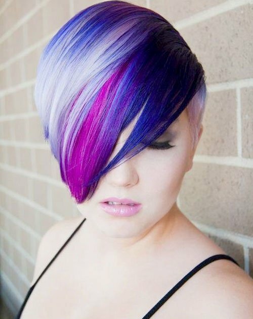 Short pixie haircut with highlights of multi-colored tones gives a ...