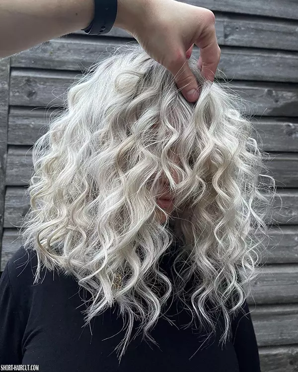 Short Curly Plantinum Blonde Hairstyle